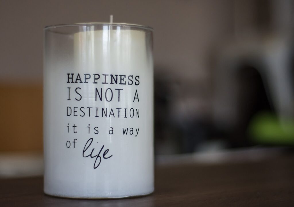 Candle with a motivational saying on it